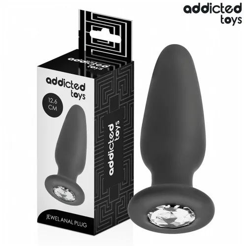 Black anal plug with gemstone, 12.6 cm, next to packaging from Addicted Toys.