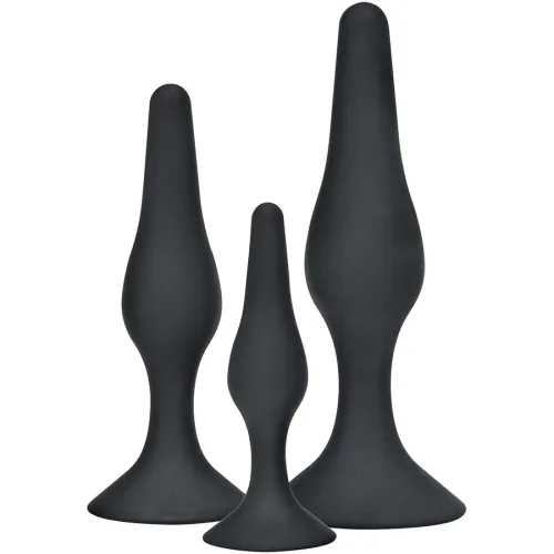 Three black, differently sized, conical objects with a wide base on a white background.