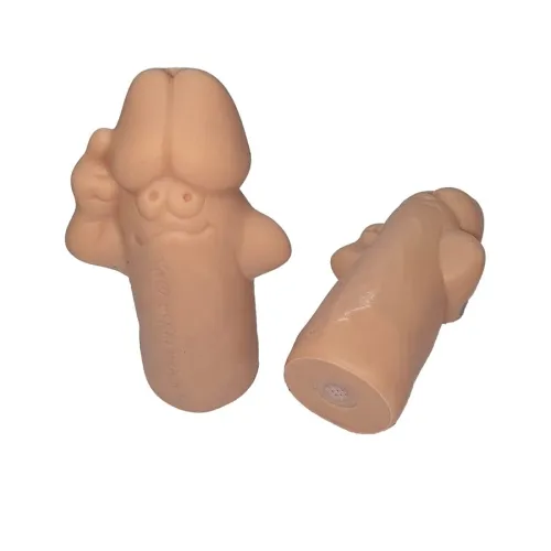 Two beige rubber figures with faces and arms, one standing, the other lying down.