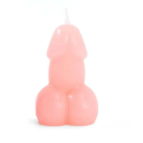 Rosa Kerze in Form eines Phallus auf weißem Hintergrund.
