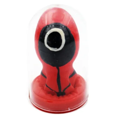 Red figure with a black face in a transparent dome, inspired by a TV series.