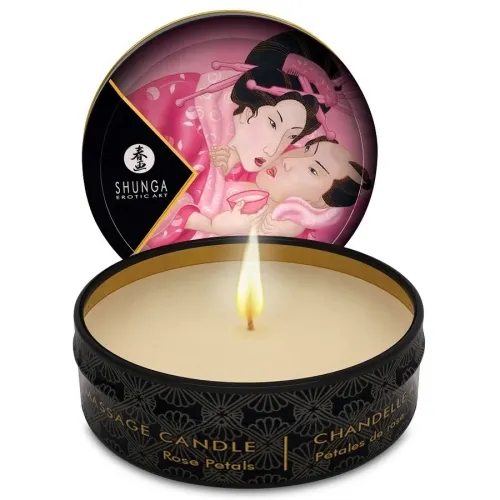 Round massage candle with burning flame, lid shows Japanese art with two people in pink robes.