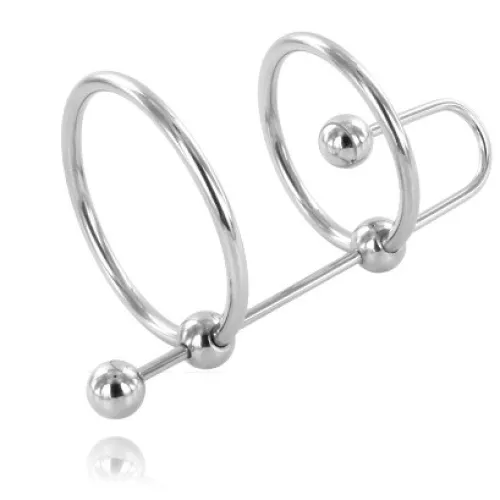 Silver metal ring with two large rings and balls, connected by a rod.