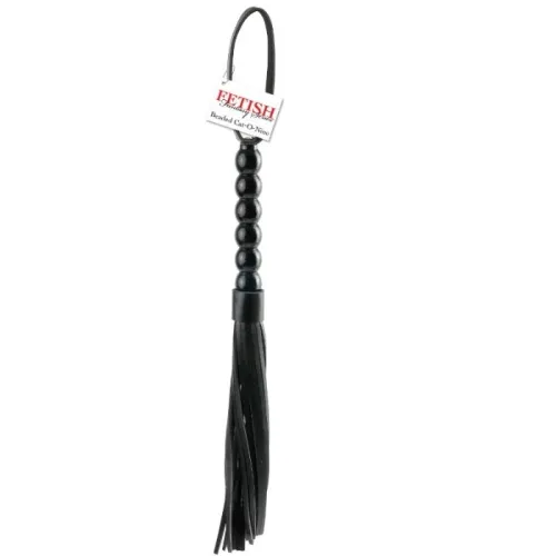 Black whip with a pearl-shaped handle and fringes, label with the word "Fetish" inscribed on it.