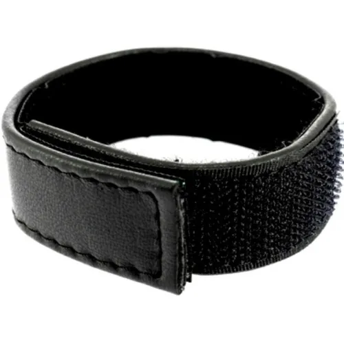 Black Velcro tape in ring form, suitable for bundling cables or other objects.