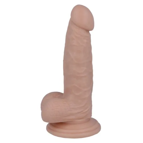 Realistisch geformtes Dildo mit Saugnapf, hautfarben, stehend aufrecht.