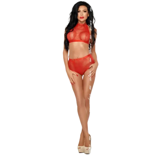 Woman in red lingerie set with transparent top and high heels against a white background.