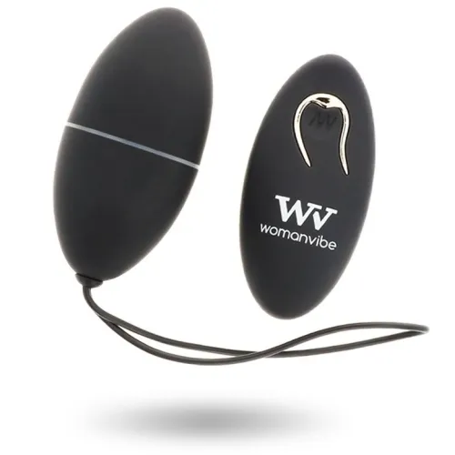 Black, egg-shaped vibrating device with remote control, brand "Womanvibe", on a white background.