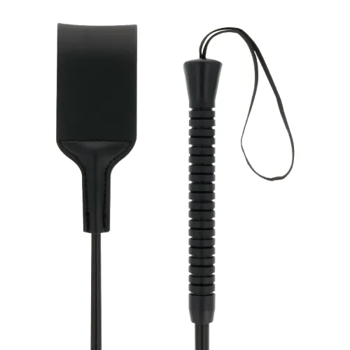 Black riding crop with grooved handle and wrist strap, next to a wide leather whip.