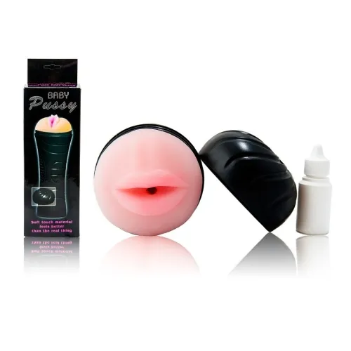 Erotic toy shaped like lips, with a black casing and a bottle of lubricant. Packaging in the background.