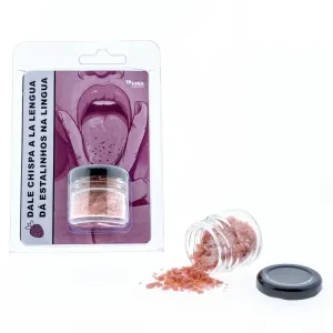 Kleines Glas mit rosa Kristallen, daneben Verpackung mit Illustration einer Zunge und Text in Spanisch und Portugiesisch.