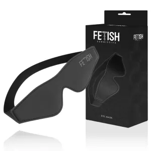 Schwarze Augenmaske mit elastischem Band, neben einer Verpackung mit der Aufschrift 