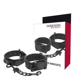 Schwarze Lederhandschellen mit Kette, Verpackung mit der Aufschrift 