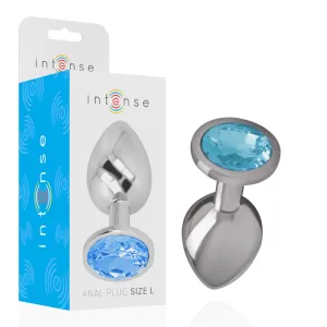 Silberner Analplug mit blauem Kristall, Verpackung im Hintergrund, Marke 