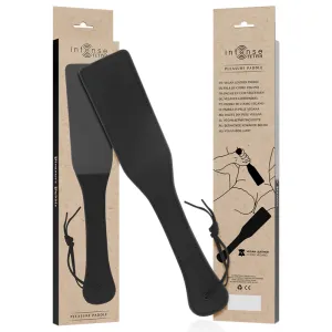 Schwarzes Paddle aus veganem Leder, verpackt in einer Box mit mehrsprachiger Beschriftung und Zeichnung.