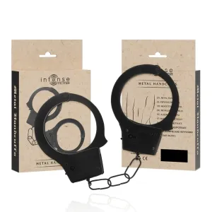 Schwarze Metallhandschellen vor Verpackung mit der Aufschrift 