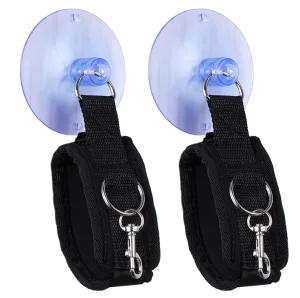 Two black handcuffs with suction cups and metal rings, arranged side by side.