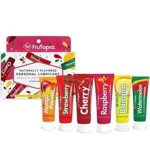 Fünf Tuben Frutopia Gleitgel in verschiedenen Geschmacksrichtungen vor einer Verpackung.