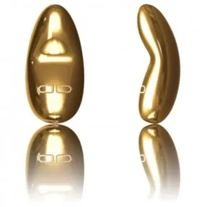 Zwei goldene, glänzende Objekte mit geschwungener Form und Tasten, auf weißem Hintergrund reflektiert.