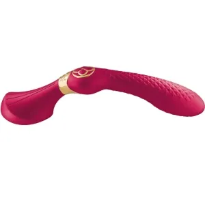Red, curved massage wand with golden accents and textured surface.