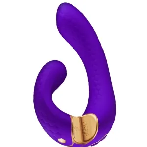 Purple, curved massager with golden accents and honeycomb texture.
