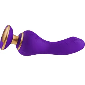 Lila und goldener Massagegerät mit geschwungener Form und strukturiertem Griff.