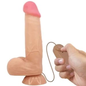 Spielzeug in Penisform mit Fernbedienung in einer Hand.
