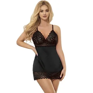 Woman in black lace nightgown with blonde hair, hand on hip, against a white background.