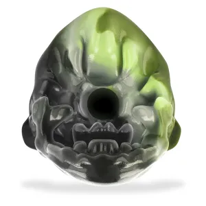 Green and black, monster-like face with open mouth and large eyes, on a white background.