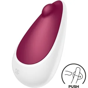 Weiß-rotes, tropfenförmiges Gerät mit Knopf und 