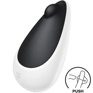 Schwarz-weißer Vibrator mit abgerundeter Spitze, daneben ein Symbol mit 