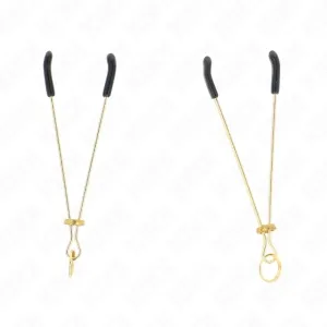 Two golden nipple clamps with black rubber tips on a white background.
