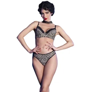 Person wearing leopard print underwear, posing in front of a white background.