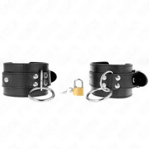 Black leather restraints with metal rings, padlock and key on a white background.