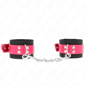 Black handcuffs with pink straps and silver chain, on a white background.