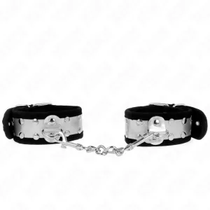 Silver handcuffs with black lining, connected by a short chain.