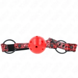 Roter Ballknebel mit schwarzem und rotem Riemen, verziert mit Schnallen und Nieten.
