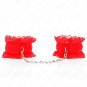 Red lace handcuffs with chain on a white background.