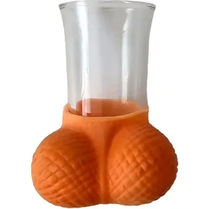 A glass with an orange, textured base in the shape of two spheres.