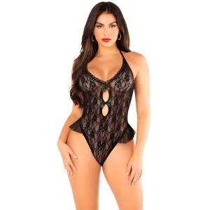 Woman in black lace bodysuit with cut-outs, standing in front of a white background.