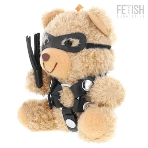 Teddybär in schwarzem Lederoutfit mit Maske und Peitsche, sitzt seitlich.