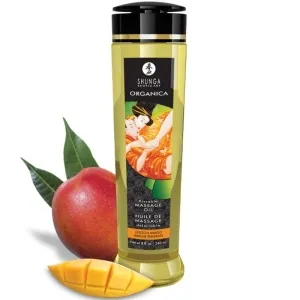 Flasche Shunga Massageöl mit Mangogeschmack, daneben eine frische Mango und ein Mangostück.