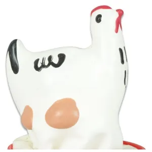 White chicken figurine with black and red details, orange spots on the side.