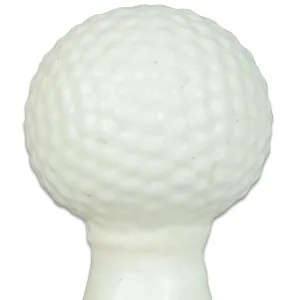 White, textured surface of an object resembling a golf ball.