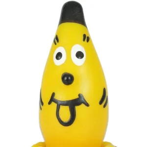A yellow, banana-shaped figure with a face, large eyes and a protruding tongue, wears a black cap.
