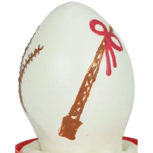 White egg with a red band and brown decoration that looks like a tower.