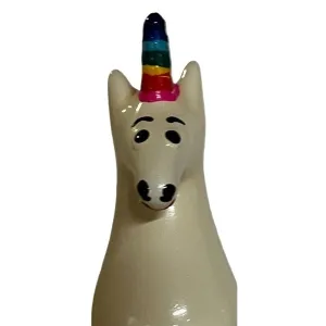 Ceramic unicorn with rainbow horn and friendly facial expression.