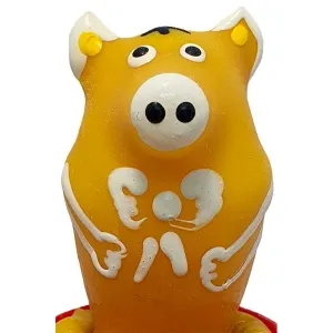 Yellow pig figurine with large eyes and white details on a red base.