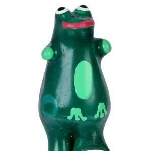 Green frog figurine with red lips and large eyes, standing with raised arms.