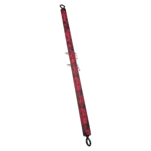 Rote und schwarze gepolsterte Stange mit Haken an beiden Enden, verziert mit floralen Mustern.